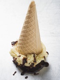 Cone of Nut Ice Cream with Chocolate Sauce