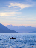 Indonesia  Sumatra  Samosir Island  Tuk Tuk  Man Fishing in Dug Out Canoe on Lake Toba