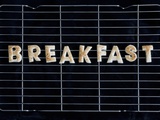 Toast Letters Spelling the Word Breakfast on a Rack