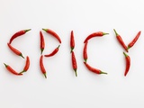 The Word 'SPICY' Written in Red Chillies