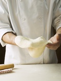 Shaping Pizza Dough by Hand (Stretching)