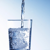 Pouring Water into a Glass