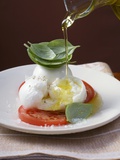 Drizzling Insalata Caprese with Olive Oil
