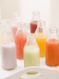 Various Different Juices in Small Bottles on Tray