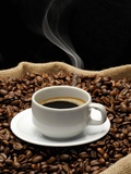 A Cup of Coffee on a Jute Sack Full of Coffee Beans