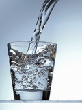 Pouring Water into a Glass