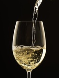 White Wine Pouring from Bottle into Glass