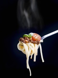 Linguine with a Minced Meat Sauce  Tomatoes and Basil on a Fork