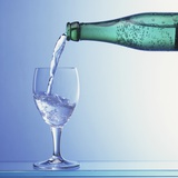 Water Being Poured from a Bottle into a Glass