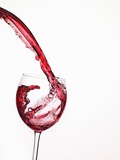 Red Wine Pouring into a Glass from Bottle