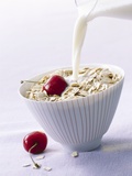 Pouring Milk onto Oat Flakes