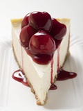 A Piece of Cheesecake with Cherry Sauce