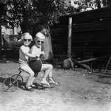 Two Children on a Tricycle