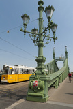 Tram and Cyclist on Independence Bridge Spanning Danube River  Budapest  Hungary  Europe