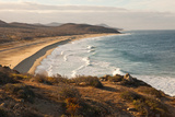 A Barely Visible Surfer on a Wave