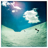 An Eleven Year Old Boy and His Mom Snowboarding in a Large Half-Pipe