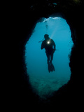 A Diver Explores an Underwater Cave in Raja Ampat
