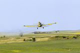Crop Duster Airplane Spraying Farm Field Near Mott  North Dakota  USA