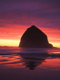 Haystack Rock Silhouetted on Cannon Beach at Sunset  Oregon  USA
